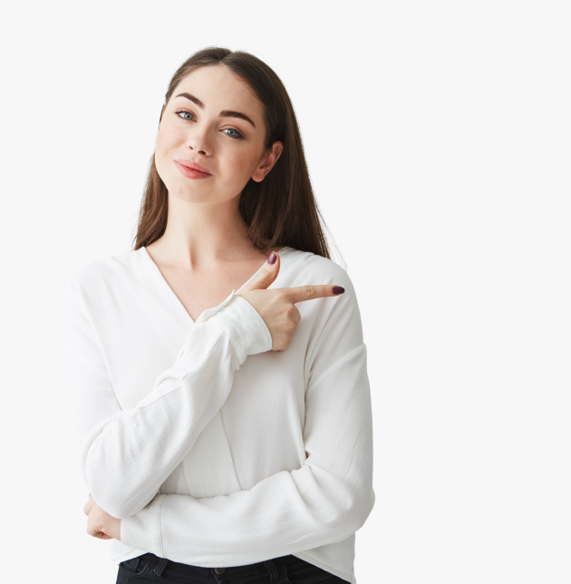 Young beautiful brunette businesswoman smiling looking at camera pointing finger in side over white background. Copy space.